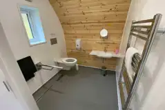 Accessible glamping pod wet room with grab rails Accessible glamping pod wet room with grab rails