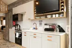 Glamping cabin kitchen with a kettle, toaster, microwave, oven and fridge Glamping cabin kitchen with a kettle, toaster, microwave, oven and fridge