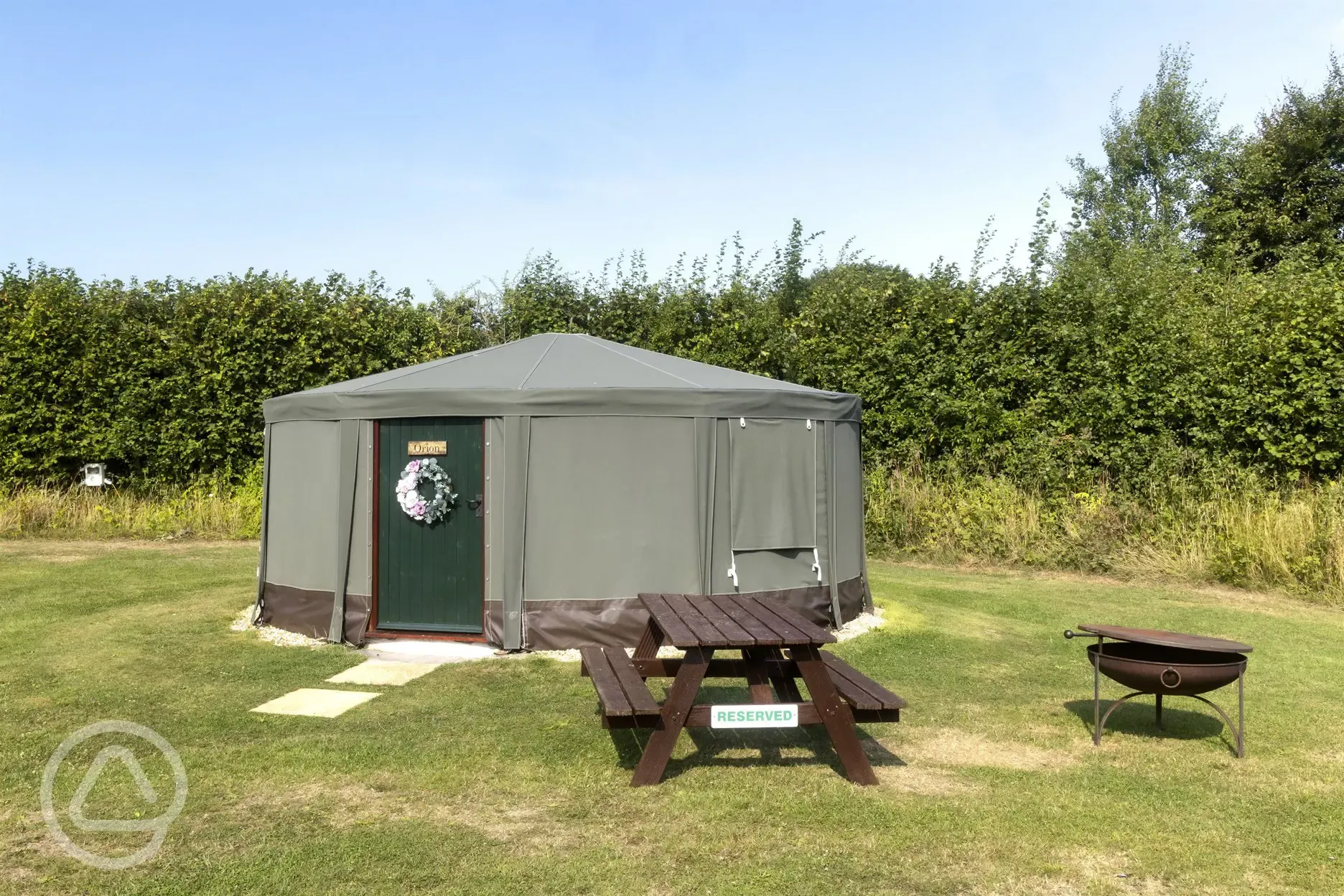 Yurt with a picnic bench and a fire pit