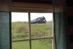 Shepherd's hut view of the passing steam railway
