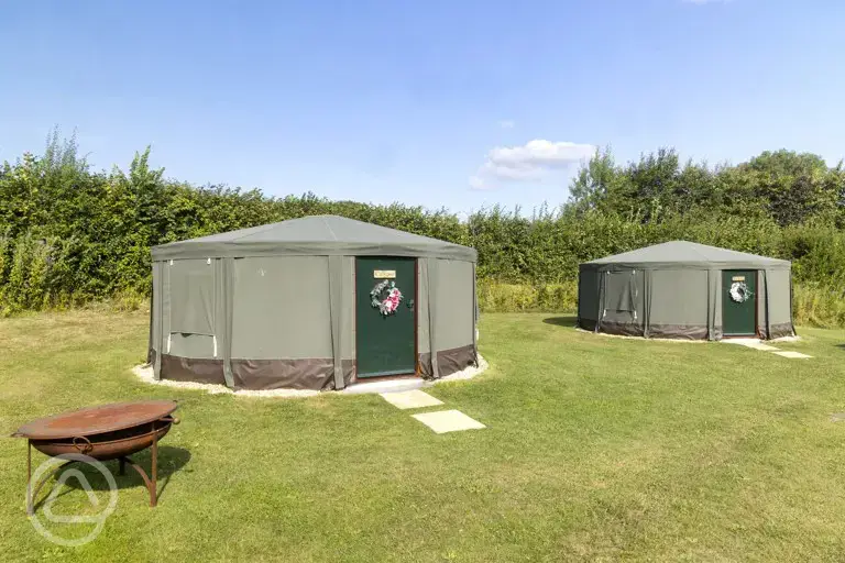 Large 5m yurts with fire pits at Woodyhyde Campsite