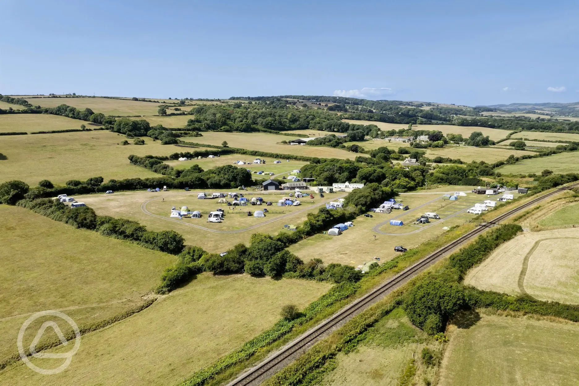 Aerial of the campsite with views of railway tracks