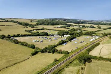 Aerial of the campsite with views of railway tracks