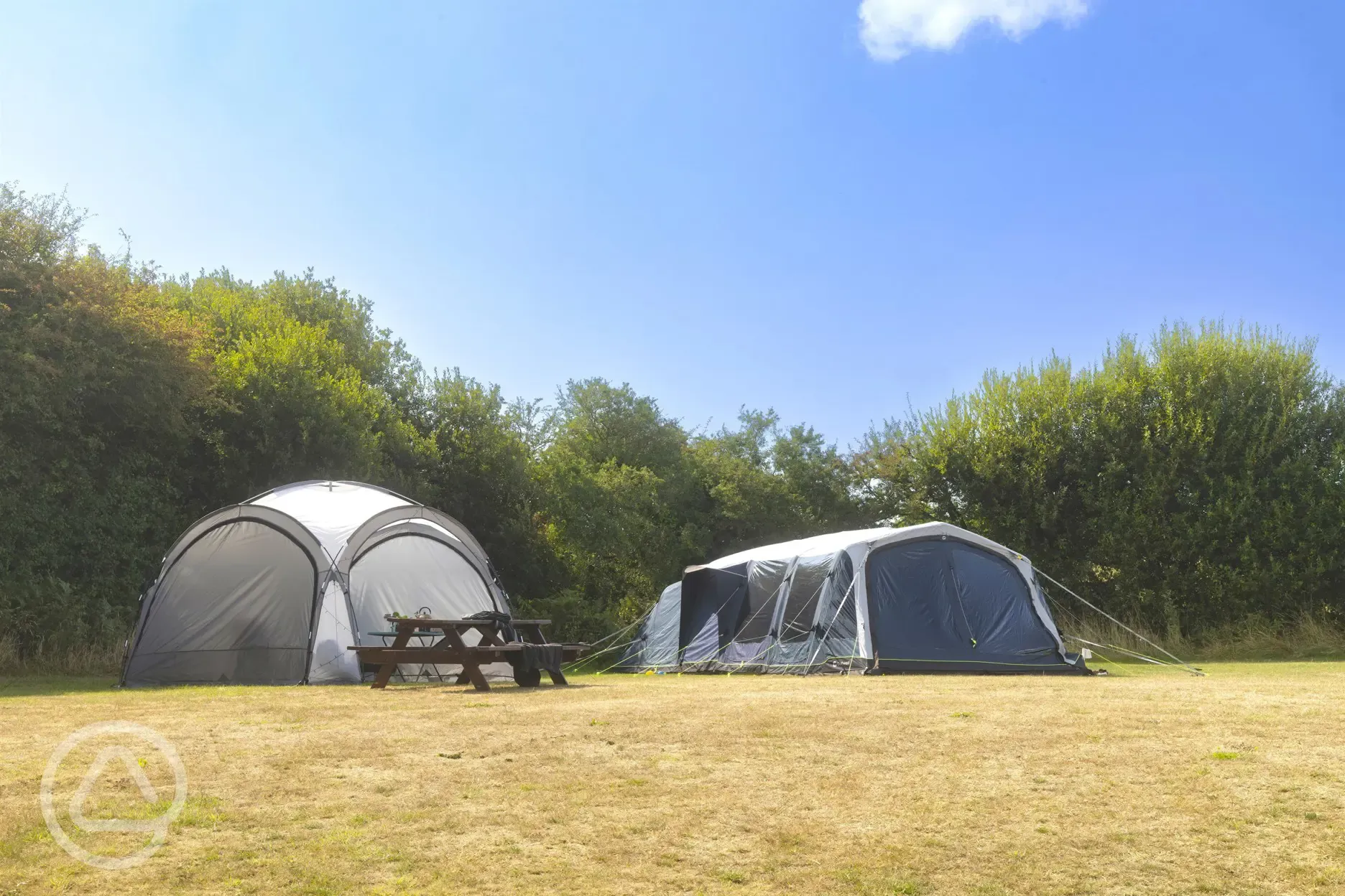 Non electric grass pitches with a picnic bench
