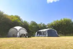 Non electric grass pitches with a picnic bench