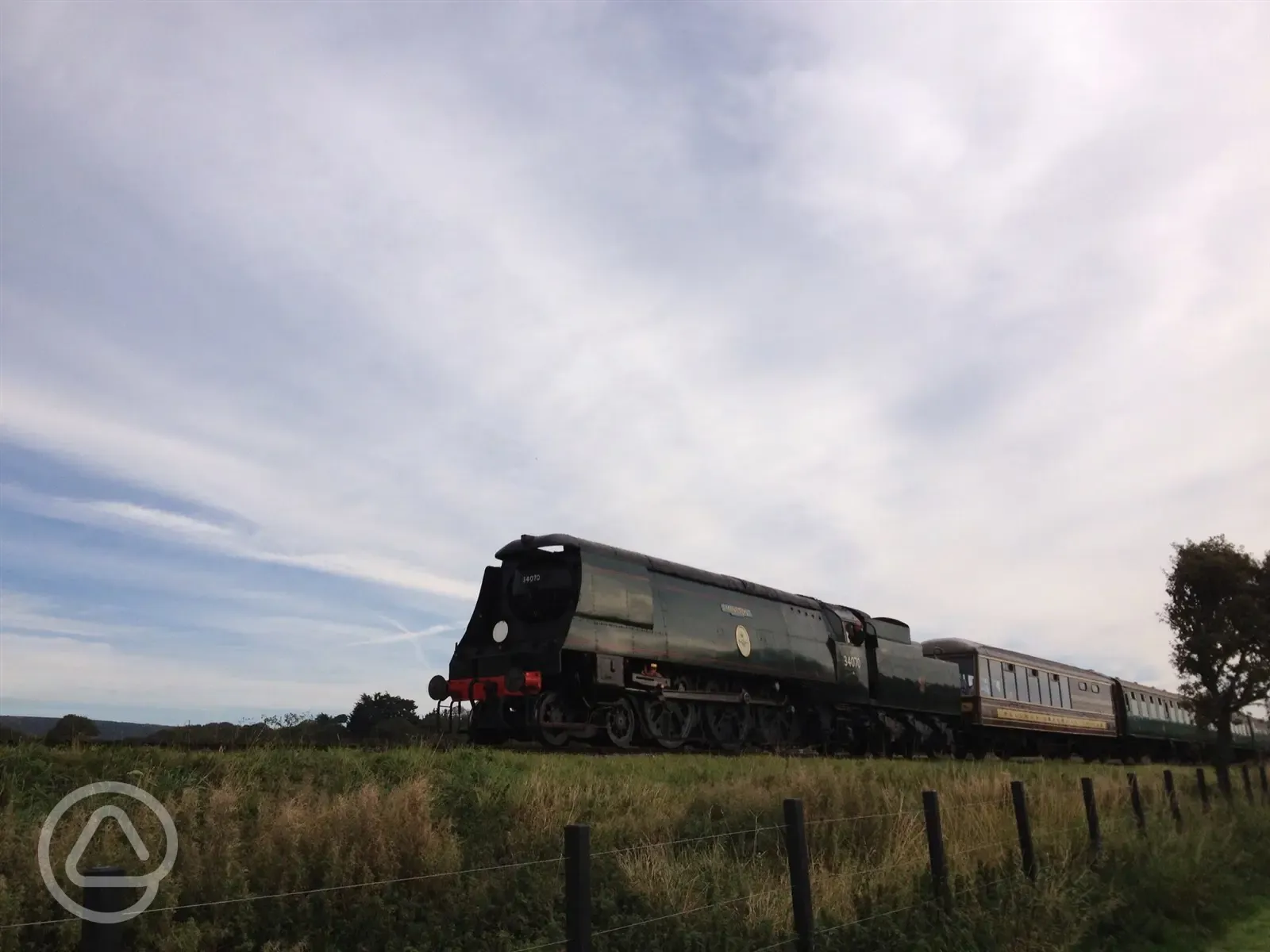 Passing steam railway