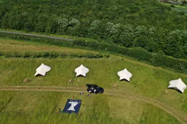 Bell tents with woodland behind