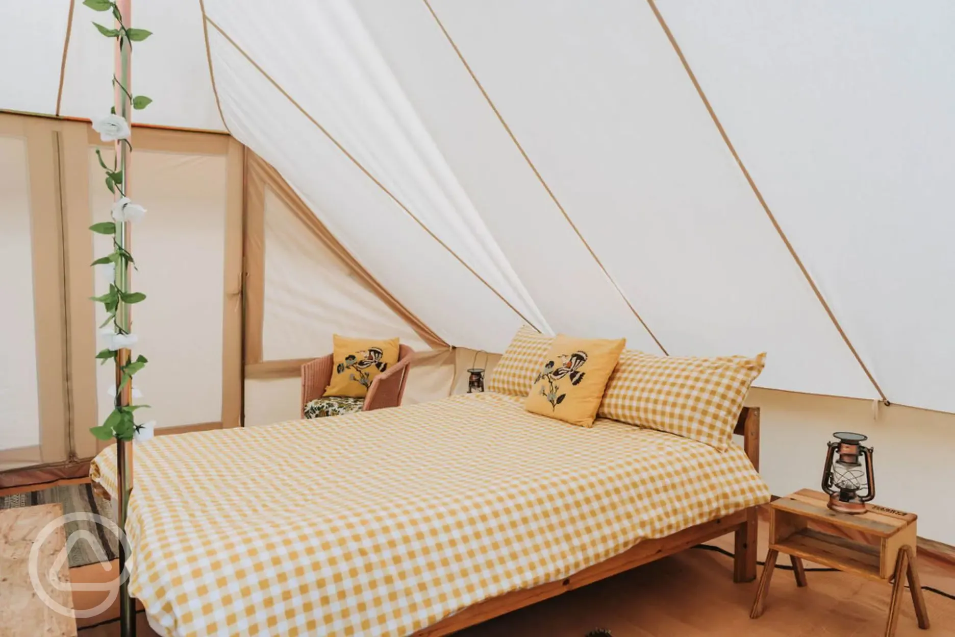 Bell tent with a double bed with bedding and extra camp beds (bring bedding)