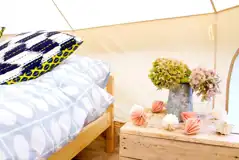 Bell tent bedside table with fairy lights