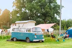 Non electric grass pitches with a campervan and awning