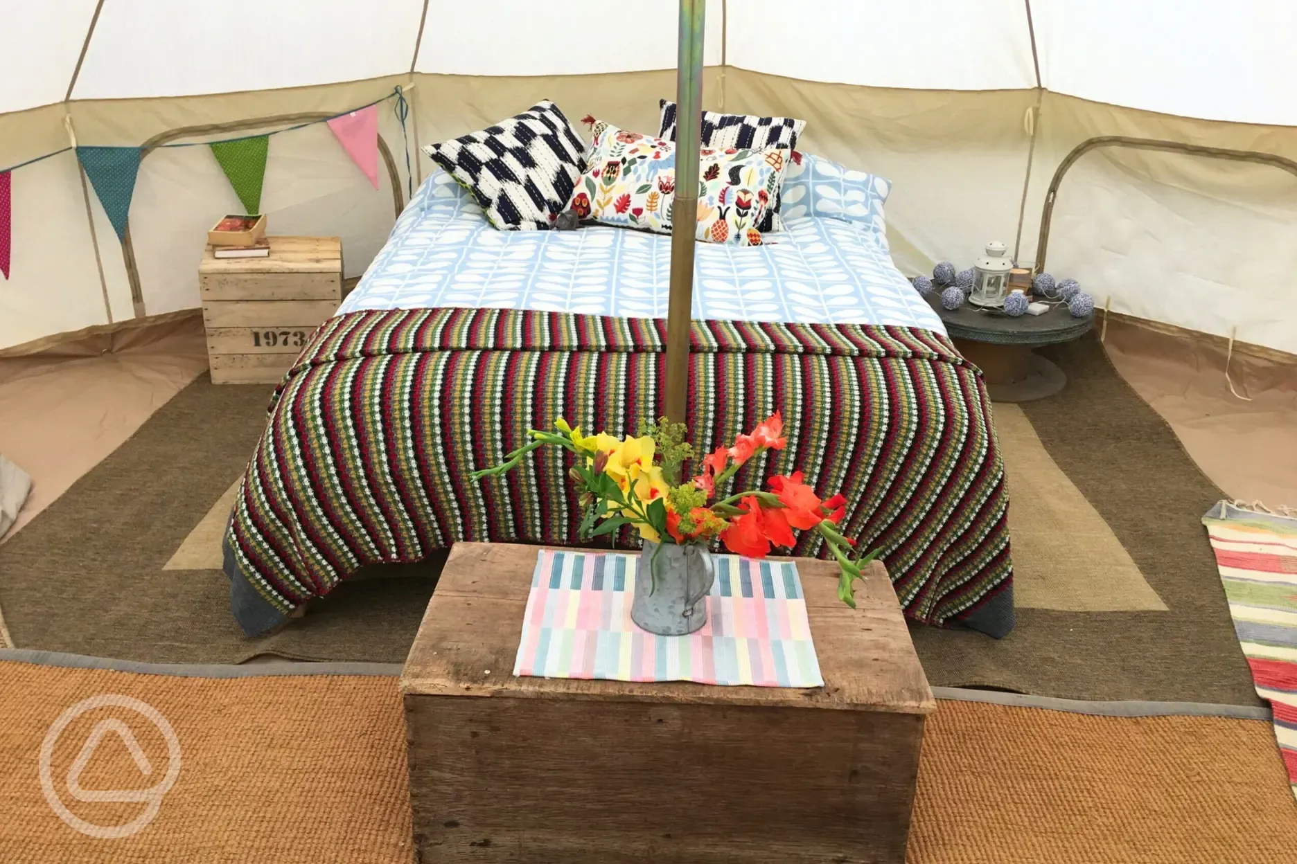 Bell tent with a double bed with bedding and extra camp beds (bring bedding)