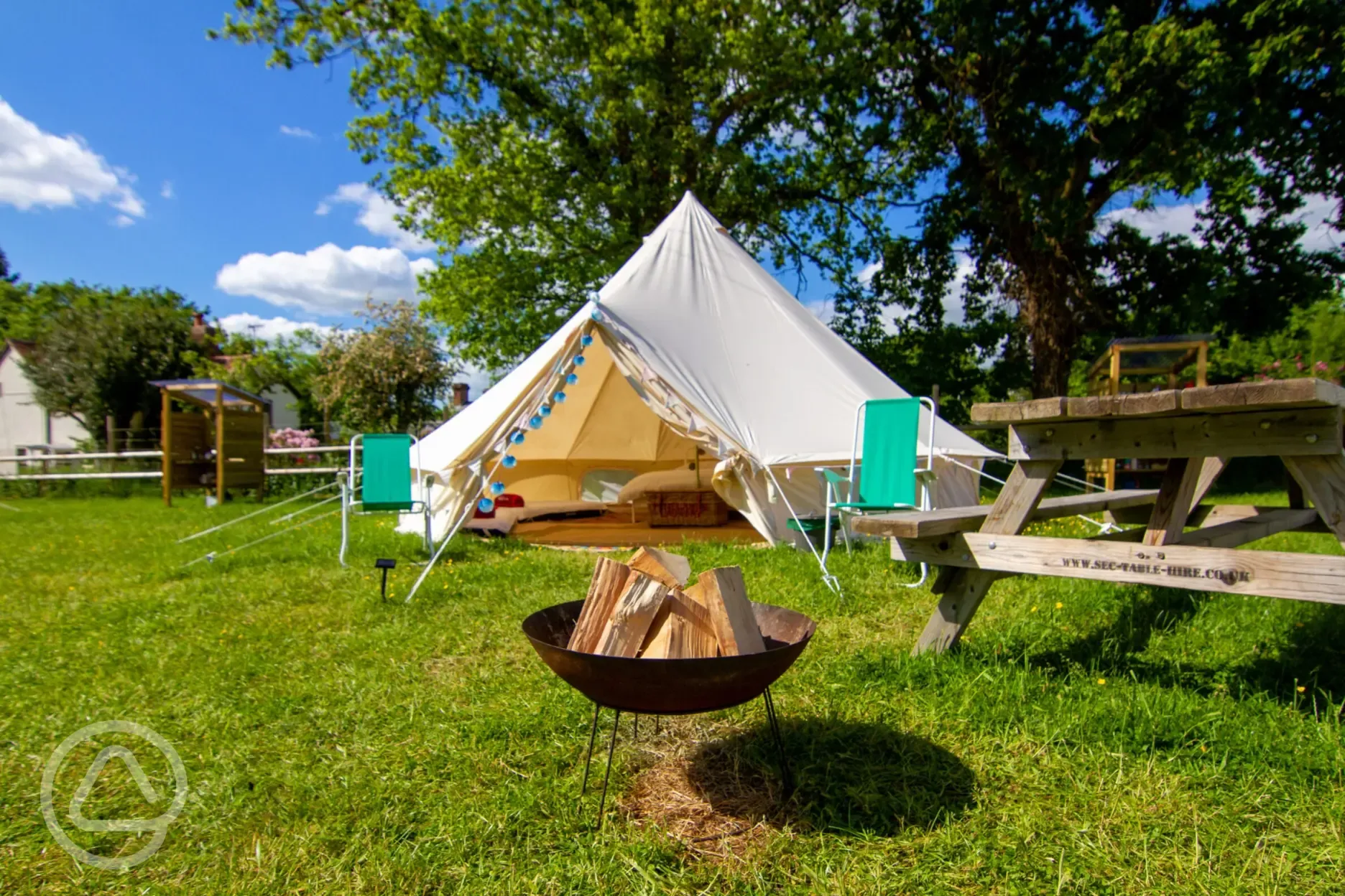 5m bell tent with outdoor seating and fire pits for hire