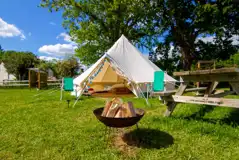5m bell tent with outdoor seating and fire pits for hire