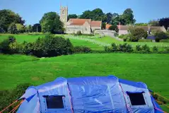 Non electric grass pitches and church views