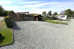 Fully serviced hardstanding pitch with a picnic hut