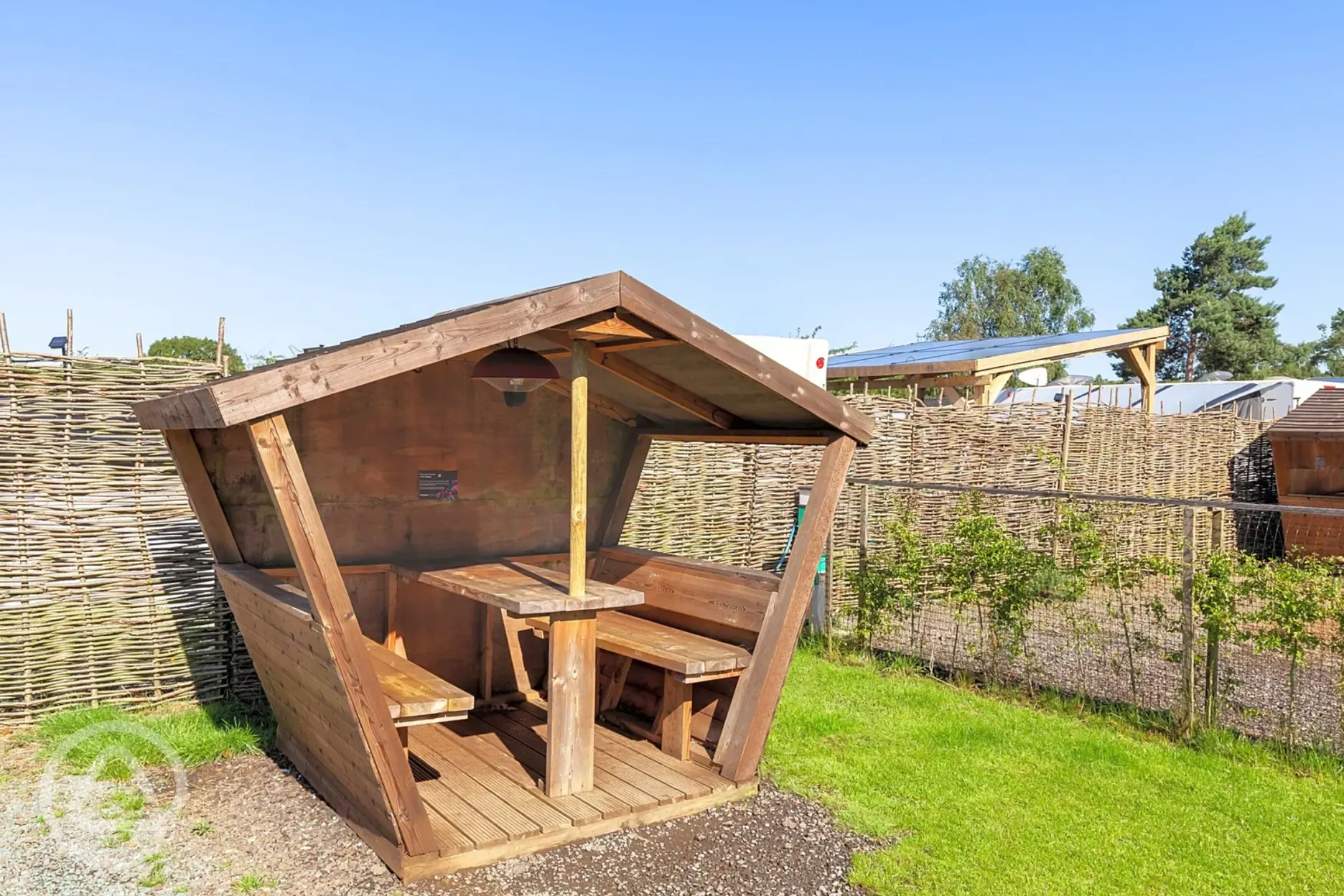 Fully serviced hardstanding pitches (pine views) with picnic hut