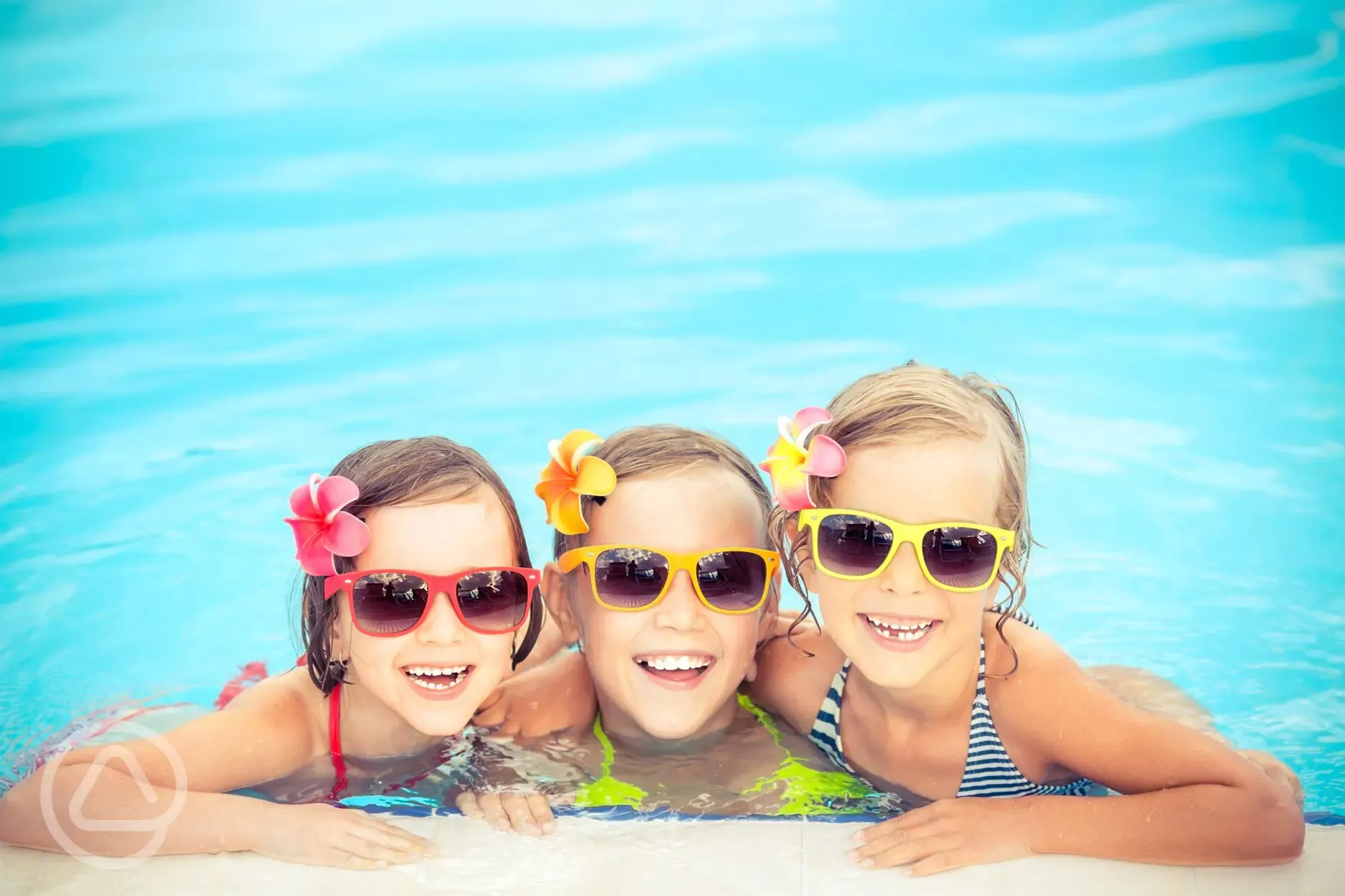 Happy children in the heated, indoor pool