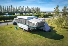 Electric grass pitches with awning space Electric grass pitches with awning space
