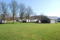 Grass pitches with a brick facilities block