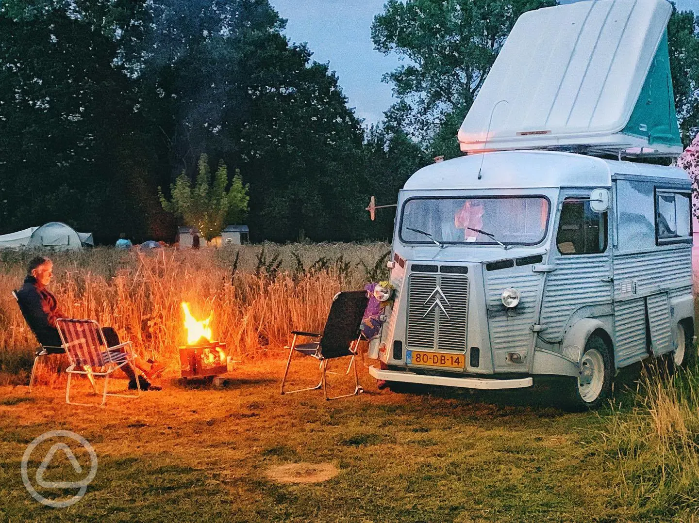 Non electric grass campervan pitches with a campfire