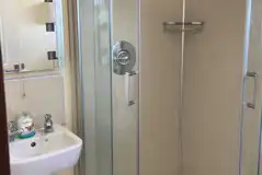 Shower interior with a mirror and sink