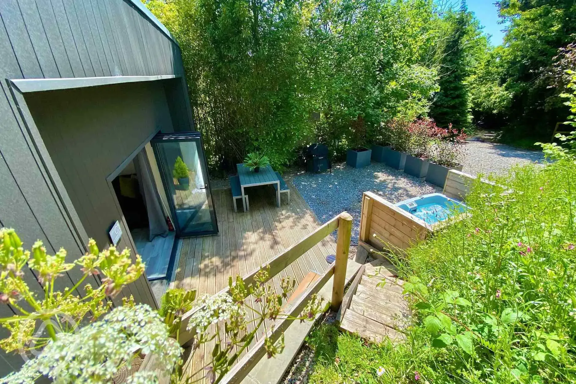 Sunrdige Cube with hot tub outdoor area with hot tub and parking