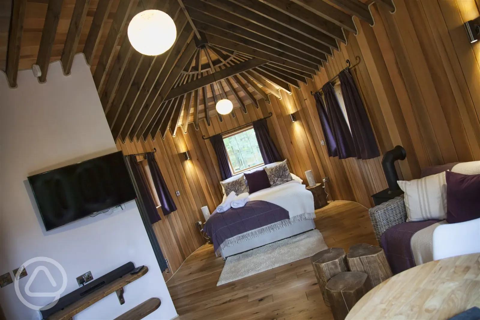 Treehouse bedroom and integral living area with widescreen TV and sound system
