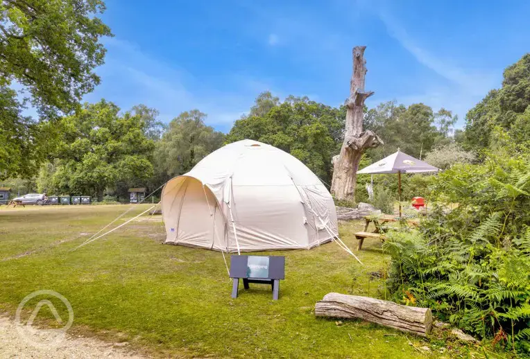 Bell tent exterior, sleeping four. Please bring your own bedding.