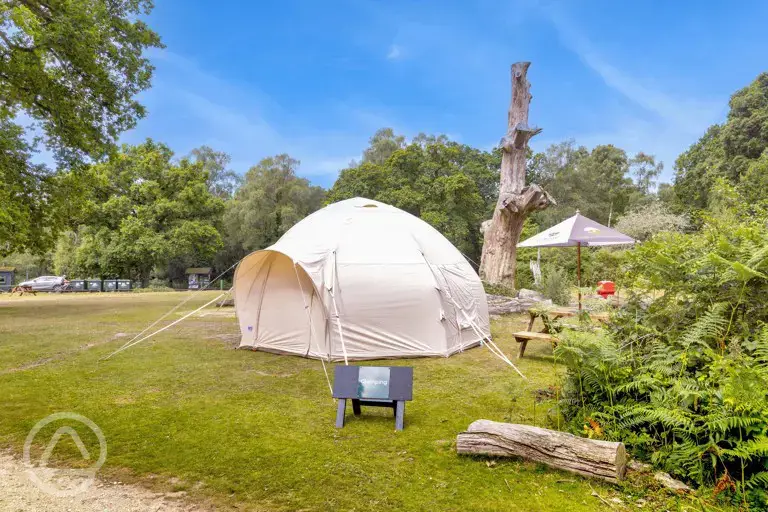 Bell tent exterior, sleeping four. Please bring your own bedding.