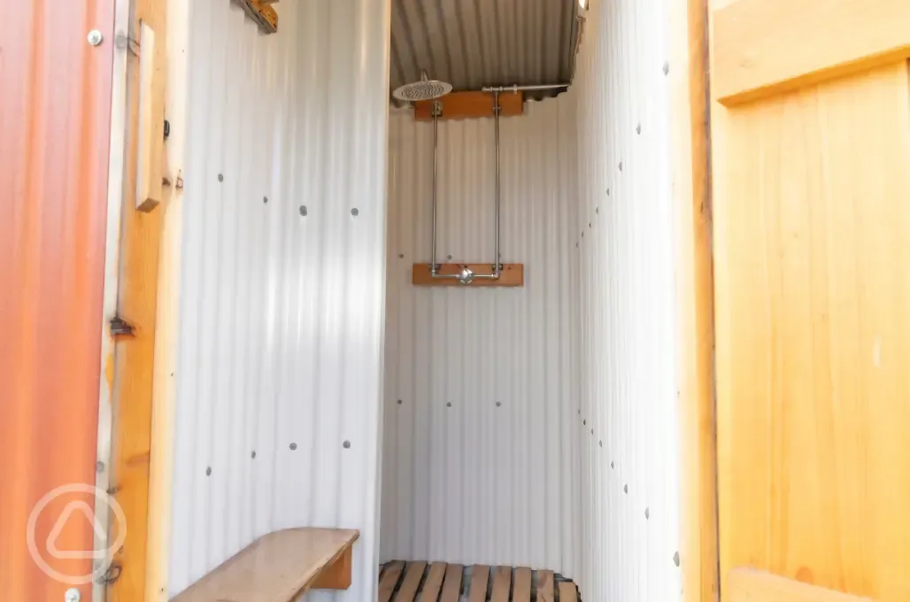 Shower facilities with a bench for your things