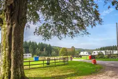Electric hardstanding pitches with the Forest of Dean behind