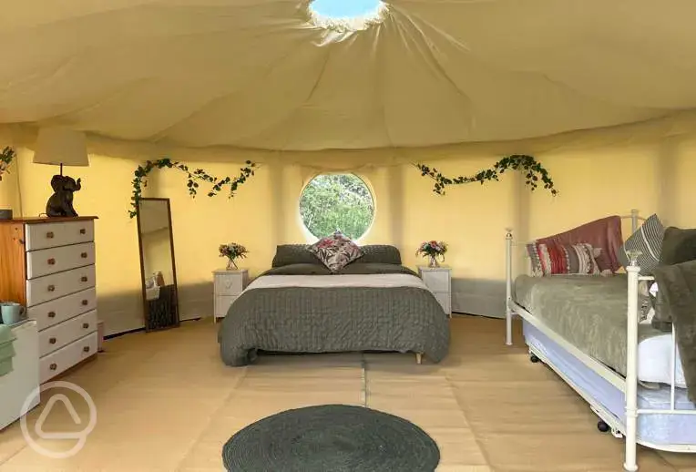 Willow yurt (dog friendly) with a double bed and day bed at Pitch and Canvas