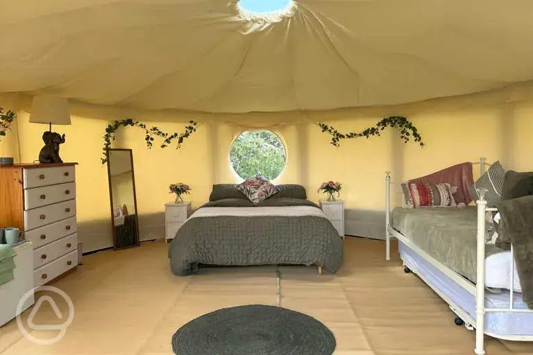 Willow yurt (dog friendly) with a double bed and day bed at Pitch and Canvas