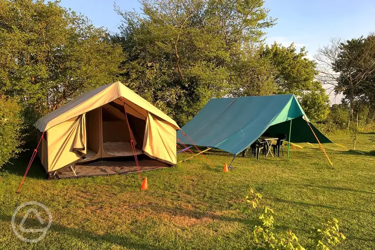 Canvas caban with a fully equipped scout tent