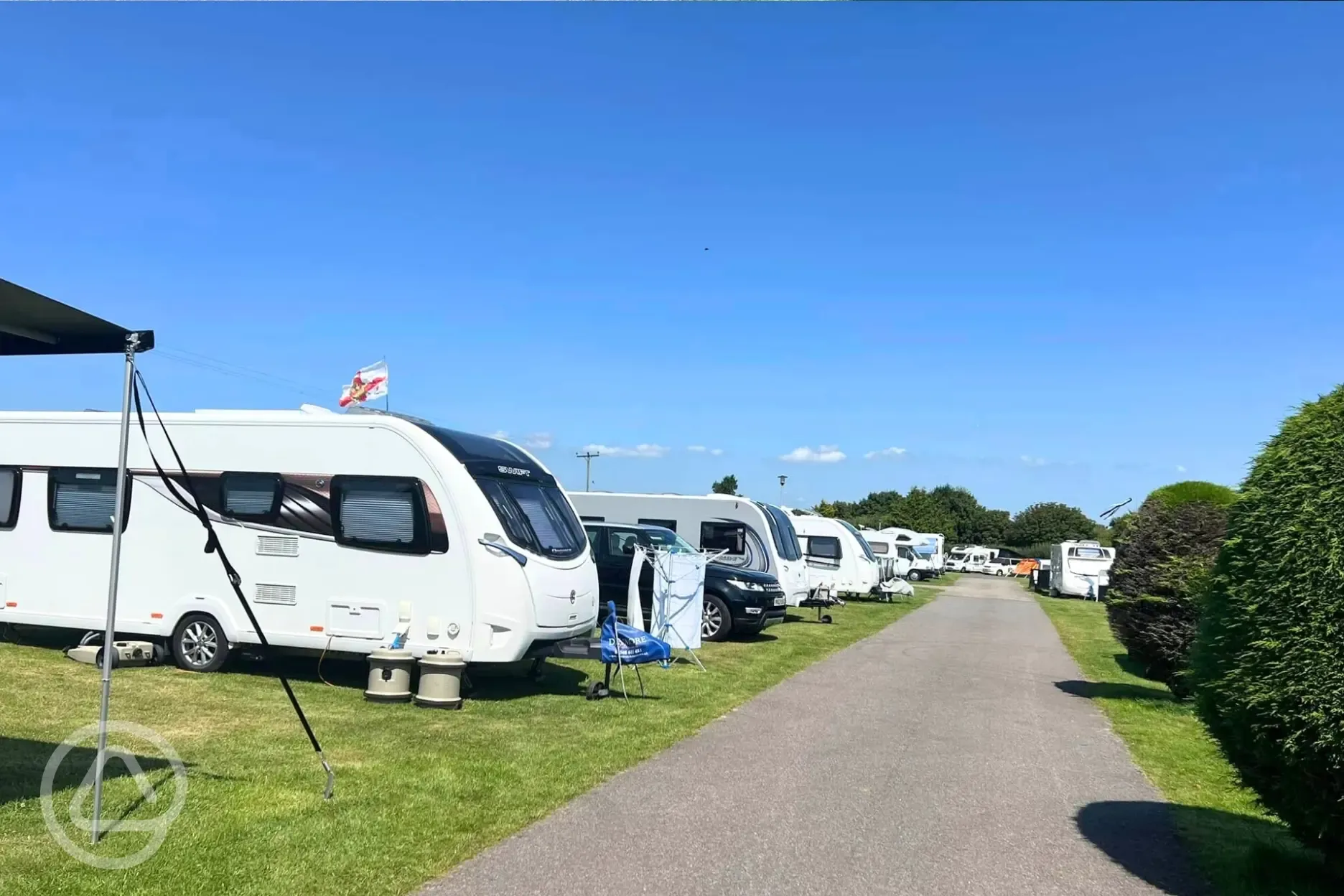 Caravans on the electric grass pitches (with awnings welcome)