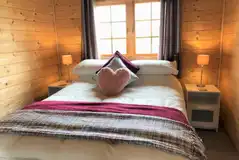 Wooden cabin double bed