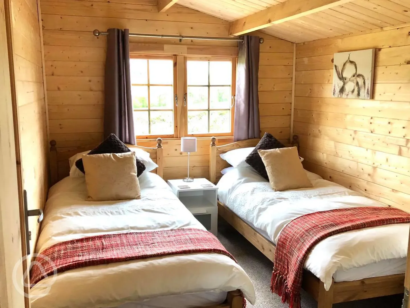 Wooden cabin twin beds