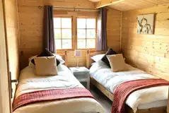 Wooden cabin twin beds