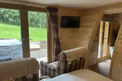 Fancy pod with arm chairs and a TV Fancy pod with arm chairs and a TV