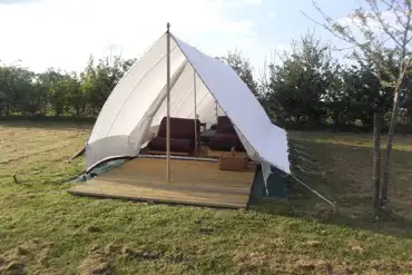 Our furnished safari tent is spacious for two or comfortable for a family of four