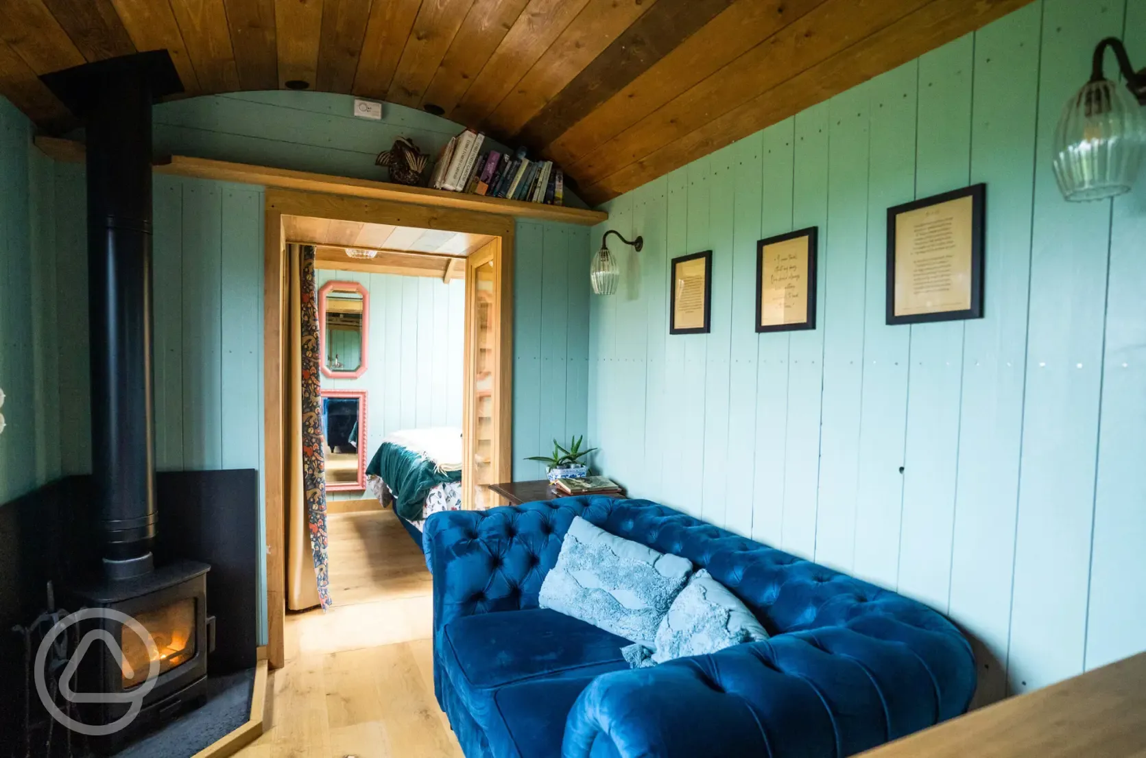 Novelist shepherd's hut wood burner and lounge area