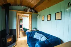 Novelist shepherd's hut wood burner and lounge area Novelist shepherd's hut wood burner and lounge area