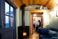 Novelist shepherd's hut wood burner and lounge area Novelist shepherd's hut wood burner and lounge area