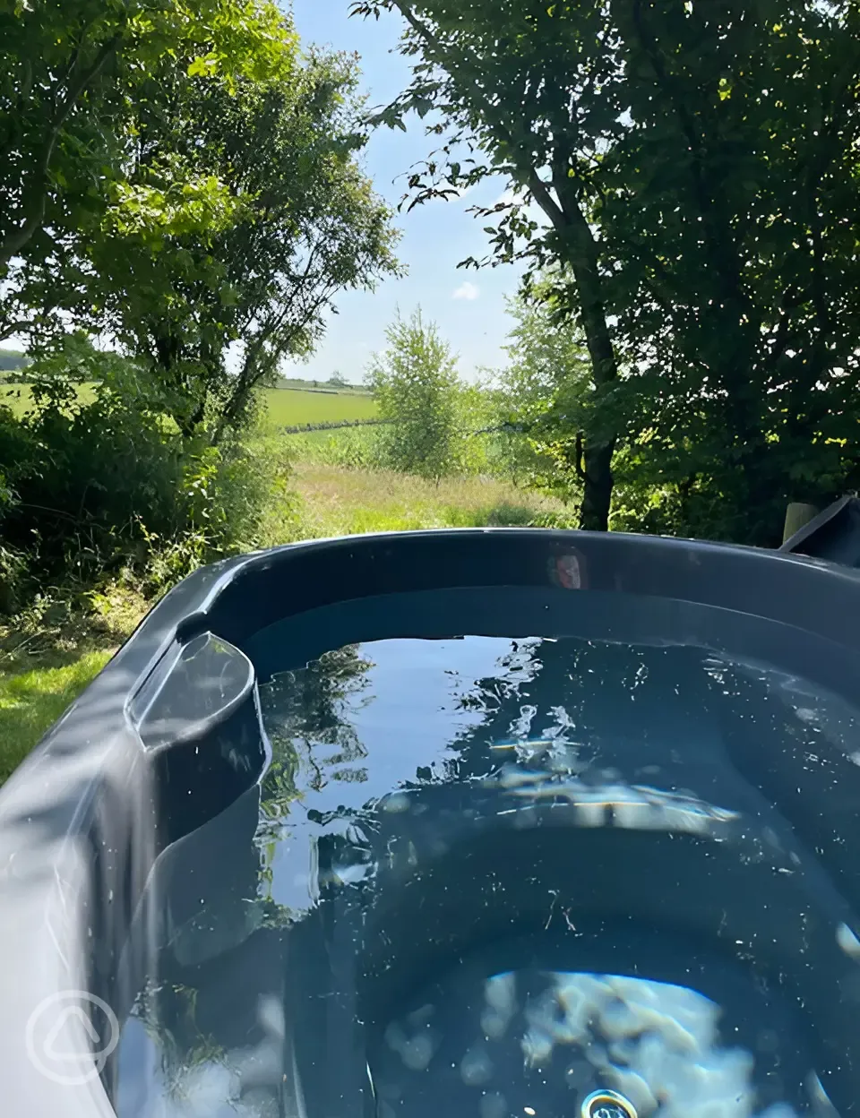 Ensuite electric grass campervan pitch with hot tub