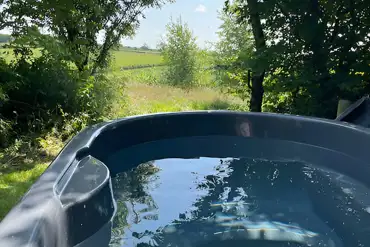 Ensuite electric grass campervan pitch with hot tub