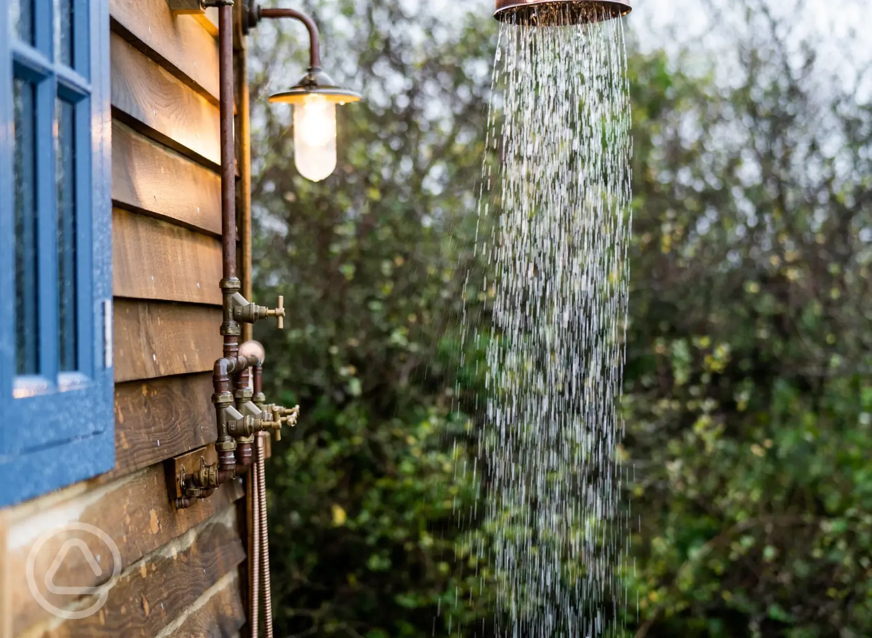 Novelist shepherd's hut outdoor shower