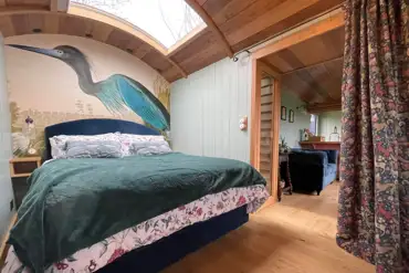 Novelist shepherd's hut king size bedroom