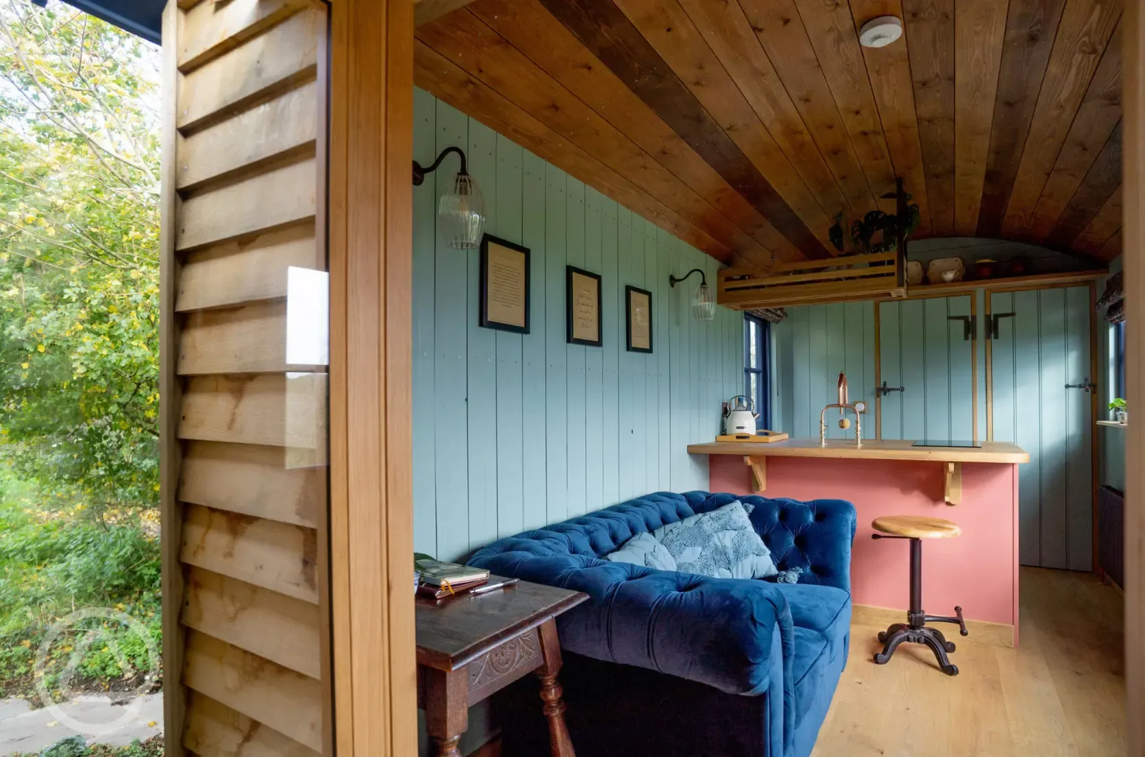 Novelist shepherd's hut lounge and breakfast bar area