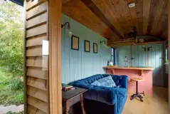 Novelist shepherd's hut lounge and breakfast bar area Novelist shepherd's hut lounge and breakfast bar area