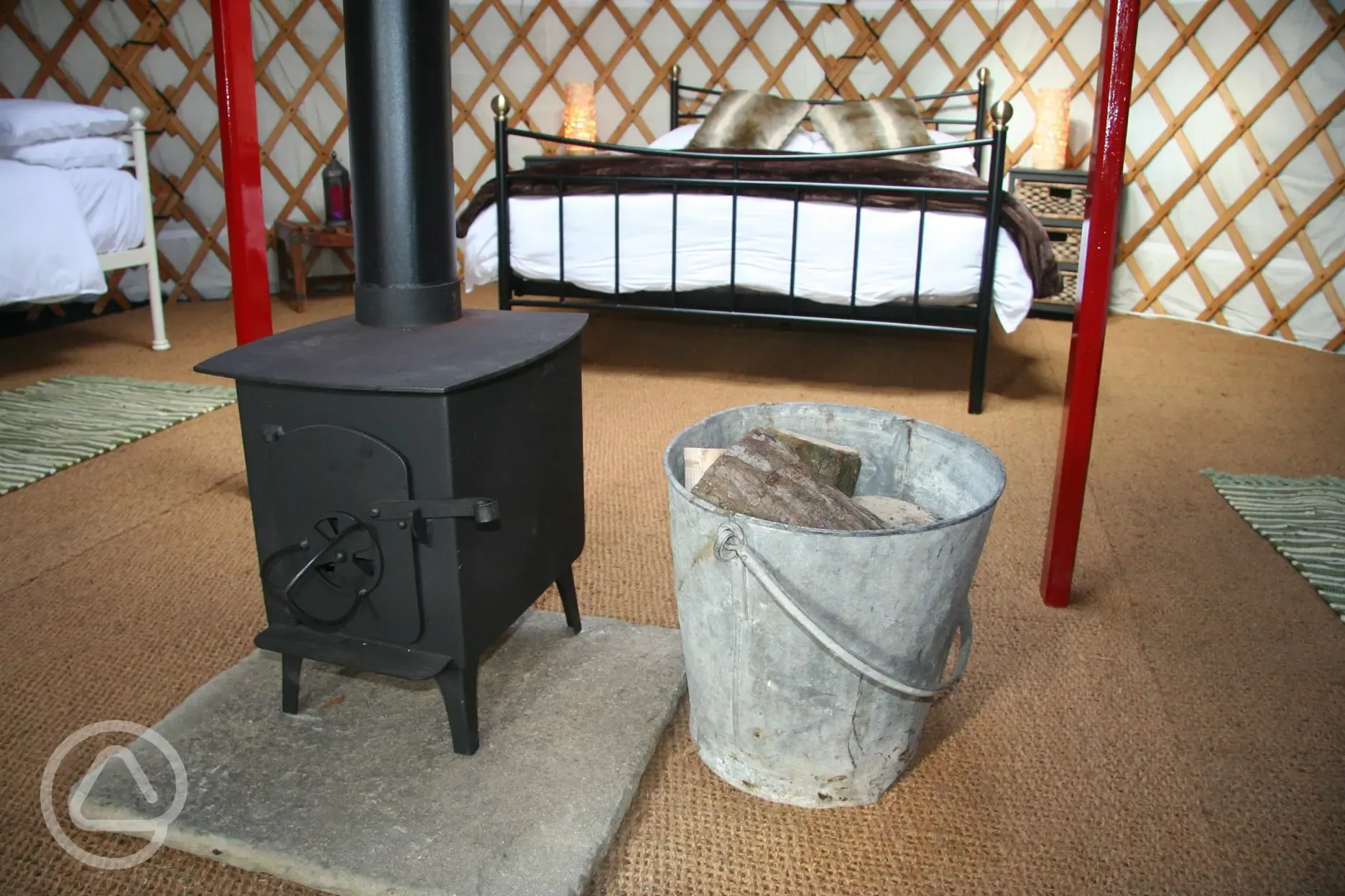 A wood burning stove with free wood keeps our yurts warm and cosy in all weathers